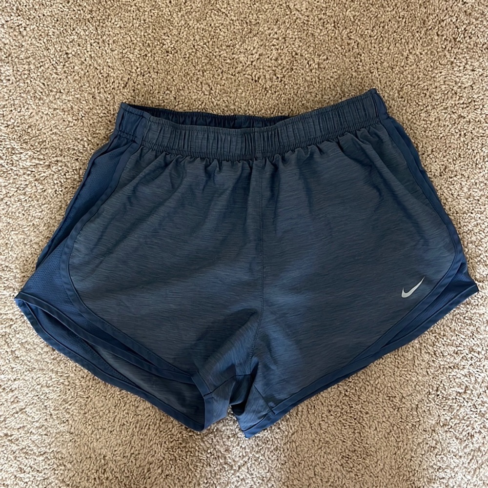 Blue Nike running shorts